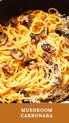 pasta with mushrooms, bacon and parmesan cheese in a skillet ready to be eaten