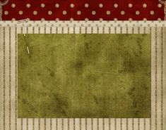 a green area rug with red and white trimmings on the border, in front of a striped background