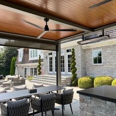 an outdoor dining area with tables and chairs