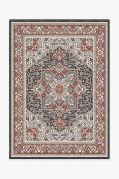 a rug with an ornate design on the front and back side, in red, blue,