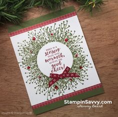 a handmade christmas card with pine branches