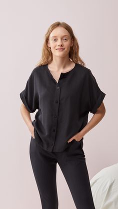 Women's black boxy button-up shirt with round neck line. Dropped shoulder line, short sleeves. Buttons down the front. Slits on sides, hem is longer from the back. Casual fit. Designed with love in Finland. Made with care in Lithuania. Knit Bottom, Active Wear Leggings, Sweaters Knitwear, Casual Fit, Solid Tops, Skirted Swimwear