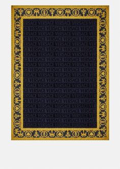 a blue and yellow area rug with words written in black on the bottom right corner