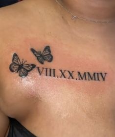 a close up of a person's chest with two butterflies on it and the words vili xx mmv