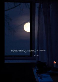 a full moon is seen through the window with a lit candle in front of it