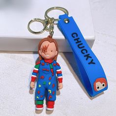 a keychain with a cartoon character on it and a name tag attached to it