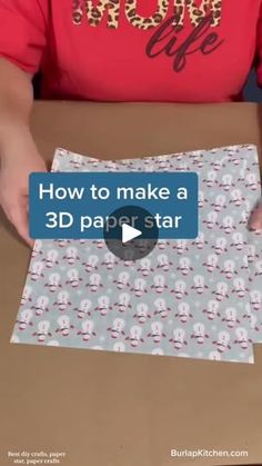 a person holding a cardboard box with an image on it that says how to make a 3d paper star