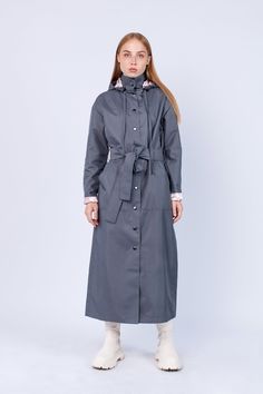 "Women Long Gray color Fashion Unique Raincoat with belt \"EL SALVADOR\" 182 Handmade in Lithuania.  Enjoy functional and stylish raincoat. This raincoat is waterproof and wind-resistant to keep you warm and dry. Raincoat is with a hood and has big pockets. Belt included. You can wear it without a belt, or if you want a more elegant look with a belt. The fabric is covered with PU. Color: Gray Material: 100% Polyester, covered with PU. Lining: 100% Rayon, Light Pink color Size: XS, S, M, L, XL, XXL Precise raincoat size (cm/inch) You can find in photos area." Belted Long Raincoat For Fall, Hooded Belted Spring Outerwear, Belted Raincoat For Fall, Winter Workwear Raincoat With Detachable Hood, Winter Workwear Hooded Raincoat, Spring Hooded Belted Outerwear, Gray Hooded Raincoat For Fall, Spring Raincoat With Detachable Hood For Rainy Weather, Long Waterproof Raincoat For Rainy Season