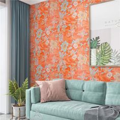 a living room with an orange and blue floral wallpaper