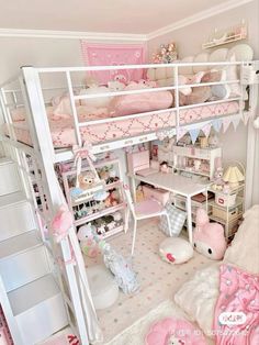 a room with a bunk bed, desk and stuffed animals