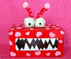 a red and white polka dot covered object with two eyes on it's face