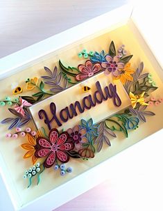 a handmade card with flowers and the word handy on it in a white frame