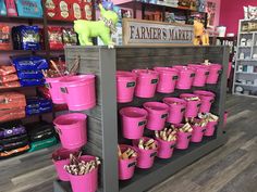 pink buckets are on display in the store