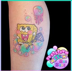 spongebob tattoo on the leg with jelly fish and jellyfish in it's mouth