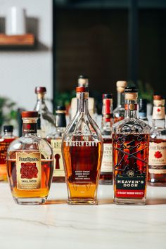 several bottles of liquor lined up on a counter