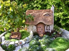 a small house made out of rocks and grass