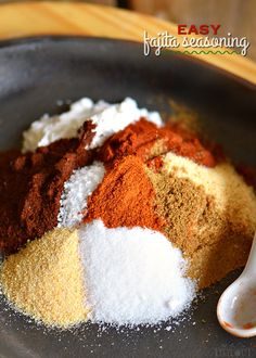 spices and seasonings in a bowl with a spoon