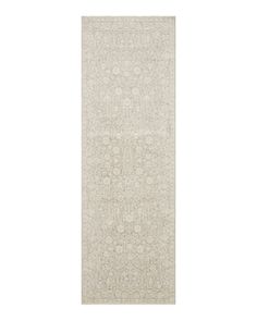 a white rug with an intricate design on it