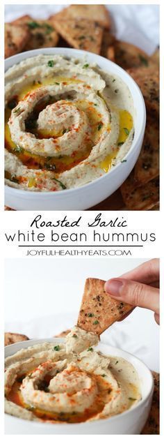 hummus in a white bowl with crackers on the side and an image of hummus