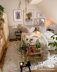 a bed room with a neatly made bed and lots of flowers on the table next to it