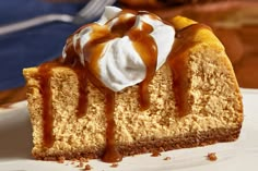 a piece of cheesecake with caramel drizzle on top