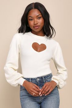 The flirty 'fits you create with the Lulus Always In Your Heart Ivory Cutout Long Sleeve Sweater Top will make sure that you're remembered as a romantic icon! Stretchy sweater knit shapes this cute top that boasts a pullover design with a crew neckline and long sleeves with fitted cuffs. The fitted bodice features an eye-catching, heart-shaped cutout at the front and falls to a slightly cropped hem. Fit: This garment fits true to size. Length: Size medium measures 21.5" from shoulder to hem. Bus Lulu Fashion, Ivory Sweater, Heart Sweater, Valentine's Day Outfit, Pullover Designs, Cute Sweaters, Cute Top, Sweater Knit, Retro Outfits