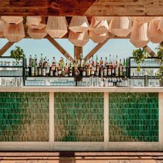 an outdoor bar with lots of bottles on it