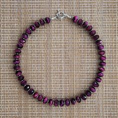 Purple Tigers Eye Necklace Brilliant Purple Color Shaped Into 6x10mm Faceted Rondelle Gemstones Silver Hematite Discs (1x4mm) Adds A Modern Look Length = 16" (About 41 Cm) All Components Are&Nbsp;925 Silver--Toggle, Lobster, Rings, Bali Beads Beads Are Imported Designed And Made By Hand In The Coachella Valley, California, Usa Longer Lengths Or Extension Available Quality Materials And Work No Dissapointments Sterling Silver Rondelle Jewelry With Silver Clasp, Sterling Silver Rondelle Gemstone Beads Jewelry, Sterling Silver Single Strand Beaded Necklaces, Sterling Silver Round Beaded Single Strand Necklace, Round Sterling Silver Single Strand Beaded Necklace, Sterling Silver Rondelle Beads For Jewelry Making, Silver Rondelle Gemstone Beads Jewelry, Sterling Silver Rondelle Faceted Jewelry, Sterling Silver Faceted Rondelle Jewelry