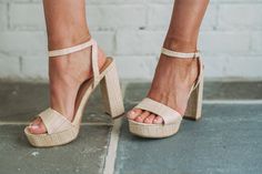 Elevate your style with our Jane Raffia Heels in Beige. Crafted with woven raffia and a subtle gold shimmer, these heels will add a touch of glamour to any outfit. Featuring a buckle closure at the ankle, a 1" platform, and 4.5" heels, these shoes combine fashion and functionality for a chic look. Run small- order up half a size High Heel Sneakers, Woven Raffia, Chic Look, Order Up, Gold Shimmer, Elevate Your Style, Your Style, High Heels, Buckle