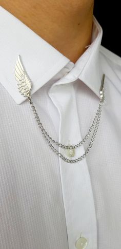 Shirt Collar Pin Angel Wing chain length 12cm  Shirt collar pin is the choice of stylish gentlemen who want to capture a different style. You can add a very stylish and different detail to your classic combinations with shirt collar pins that can be used with perforated shirt collars. Luxury Suits With Concealed Placket And Suit Collar, Luxury Menswear-inspired Collared Tops, Luxury Collared Menswear-inspired Top, Suit Accessories Party, Luxury Suits With Lapel Collar, Luxury Menswear-inspired Suit With Lapel Collar, Luxury Business Casual Shirt With Collar, Collar Pins Necklaces, Collar Pins Watches