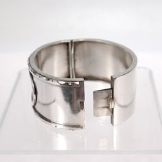 A fine, antique Aesthetic Period bangle bracelet.  In sterling silver.  With an engraved Japonismé pattern including a bird and leaves in a oval cartouche to the center of cuff. Each outside edge is finished with a repeating, notched pattern.  Opens with an integral hinge and secured with a box clasp.  Simply a wonderful Aesthetic Movement cuff bracelet!  Date: 19th Century  Overall Condition: It is in overall good, as-pictured, used estate condition.   Condition Details: There are some light be Luxury Engraved Round Cuff Bracelet, Formal Engraved Bangle Cuff Bracelet, Formal Engraved White Gold Bangle, Luxury Engraved Cuff Bangle Bracelet, Luxury Engraved Bangle Cuff Bracelet, Formal Etched Cuff Bracelet, Luxury Silver Cuff Bracelet, Luxury Silver Round Cuff Bracelet, Elegant Etched Cuff Bangle Bracelet