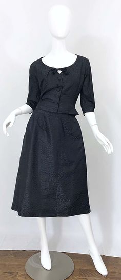 For Sale on 1stDibs - Chic 1950s ADELE SIMPSON black silk two piece blouse and skirt! Features a tailored 3/4 sleeves blouse with tie at center neck. Silk Covered buttons up Silk Two Piece, Vintage 50s Dress, Informal Dress, 1950s Outfits, Vintage Dresses 50s, 1960's Dress, Sleeves Blouse, Fringe Dress, Puff Sleeve Dresses