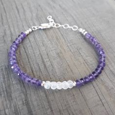 This Lovely, Handmade Bracelet Features 4 Mm Faceted Rondelle Natural Purple Amethyst Gemstone Beads, As Well As 5 Mm, Faceted Rainbow Moonstone Gemstone Beads. This Bracelet Length Is Adjustable From Approximately 7" To 8" Inches , To Fit Most Wrists. The Components Of This Bracelet Are Sterling Silver, Including A Small Sterling Silver Clasp And A Sterling Silver Chain Extender. Small Beaded Bracelets Purple, Amethyst Beaded Bracelet, Amethyst Bracelet Beads, White Beads Bracelet, Lava Stone Bracelet, Faux Pearl Bracelet, Gems Bracelet, Swarovski Bracelet, Moonstone Bracelet