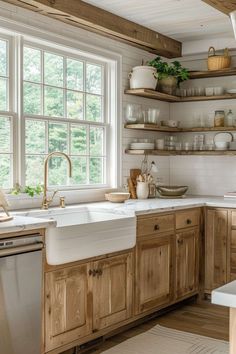 a kitchen filled with lots of wooden cabinets and white counter tops next to a window