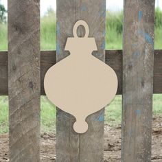 an ornament hanging on a wooden fence