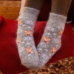 To help you stay warm and cozy on a cold night, you'll want to cuddle with Siberia Spirit's cute foxes. With their pointy ears and fluffy tail wrapped around their little paws, their Frisky Foxes will snuggle your feet and keep you toasty. A light dusting of powdery snowflakes surrounding the foxes completes the design, creating an adorable pair of socks. Siberia Spirit's amazing properties are ultra warm, odor resistant, wick moisture, and ideal thermoregulator. Also are great for around the ho Cute Foxes, Camp Socks, Thick Wool Socks, Fluffy Tail, Pointy Ears, Warm Slippers, Acrylic Fiber, Cold Night, Cute Fox