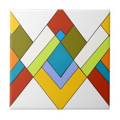 a square tile with multicolored squares on it