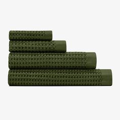 three green towels stacked on top of each other