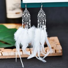 43548387737794 Boho Wedding Jewelry, Metaphysical Jewelry, Boho Feathers, Rice Bead, Beaded Drop Earrings, White Feathers, Beaded Material, Feather Earrings, Vintage Bohemian