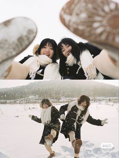 two girls are playing in the snow