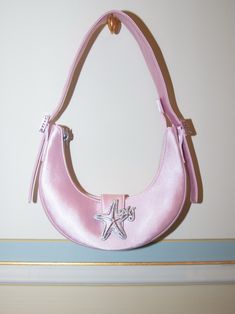 THIS ITEM IS FINAL SALE AND NOT ELIGIBLE FOR A RETURN OR EXCHANGE The little bag that goes with everything. Our Viviana Purse is everyone's favorite go-to underarm bag with a twist. It stands out from the crowd with the starfish zircon buckle that immediately enhances any look. Alternative Disney Princesses, Purse Pink, Malibu Barbie, Best Handbags, Human Poses Reference, Underarm Bag, Pretty Bags, Cute Bags, Pink Bag