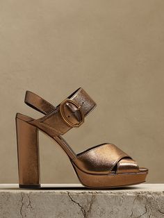 Saw this on Banana Republic: Luxury Metallic Platform Sandals, Metallic Leather Heels With Buckle Closure, Modern High Heel Sandals With Tang Buckle, Metallic High Heel Sandals With Buckle Closure, Metallic Leather Open Heel Shoes, Metallic Leather Sandals With Open Heel, Evening Leather Platform Sandals, Metallic Leather Ankle Strap Sandals, Elegant Ankle Strap Heels With Leather Footbed