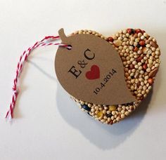 an ornament made out of bird seed with the word e & c on it