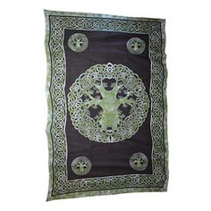 a green and black square scarf with an intricate design on the center, surrounded by circles