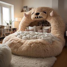 a bed with a large stuffed animal on top of it