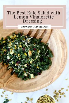 the best kale salad with lemon vinaigrete dressing in a wooden bowl