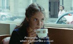 a woman sitting at a table with a coffee cup in her hand and the caption reads, personal, like life when it's most like a novel