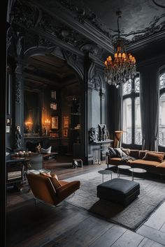 a living room filled with furniture and a chandelier