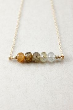 Here is a stunning, natural golden rutile quartz ombre bar necklace. Each stone is faceted and spotted with natural characteristics, making each stone unique. We added stardust beads at the ends to add extra sparkle! This is such a versatile necklace, definitely one of our favourites. Stone & Size: Golden Rutile Quartz 7mm Pendant Size: Approx. 30mm from end to end Setting: Sterling Silver, 14K Gold Filled - - - - - - - - - - - - - - - - - - - - - - - - - - - - - - - - - - - - - - - - - - - Brunch Attire, Ombre Necklace, Necklace Combo, Silver Bar Necklace, Rutile Quartz, Handmade Fine Jewelry, Silver Bar, Branded Gifts, Silver Bars