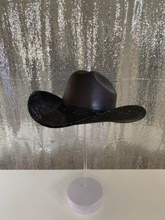 Our "Blacked Out" hat features our black hat+ jet black rhinestones. Perfect for those wanting a rhinestone hat but with more of a slightly subdued look due to the black rhinestones. Don’t be fooled, this hat is gorgeous and the jet black rhinestones sparkle and shine! This can easily go with any outfit and can be worn all year long. This hat features: Black straw hat Jet black rhinestones on both brims with a matching black hat band Sizing: Our black hats have both sizes M and XL that features Black Cowgirl Hats, Cute Black Cowgirl Hats, Black Rhinestone Cowboy Hat, Rine Stone Cowgirl Hat, Luxury Black Cowboy Hat For Western-themed Events, Rhinestone Hat, Black Straw Hat, Rhinestone Cowgirl, Black Cowboy Hat